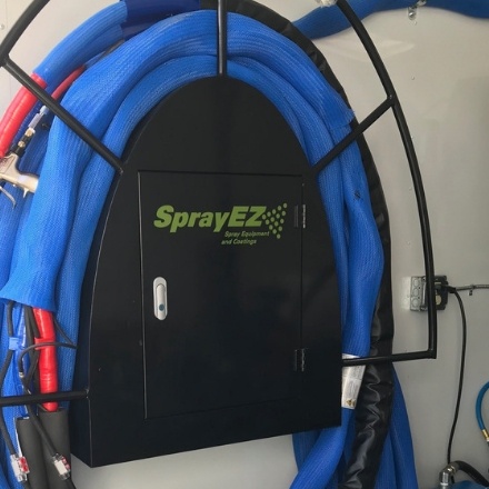 Close up o f SprayEZ hose rack with hose wrapped around it